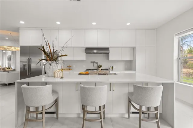 a living room with furniture wooden floor and a table