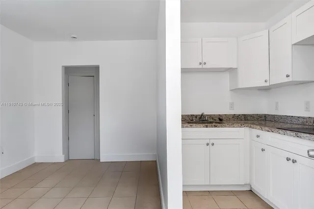 a view of cabinets and window