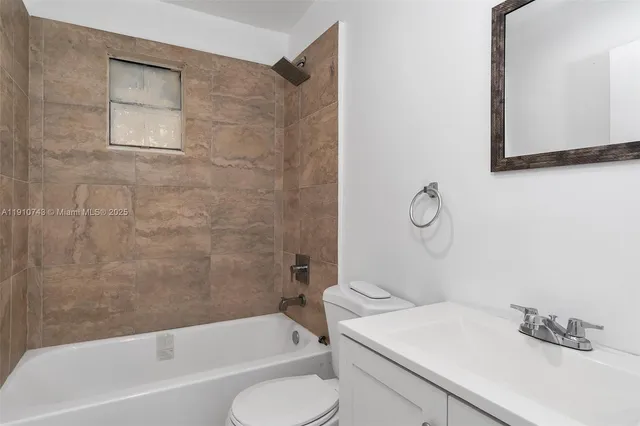 a bathroom with a sink toilet and bathtub