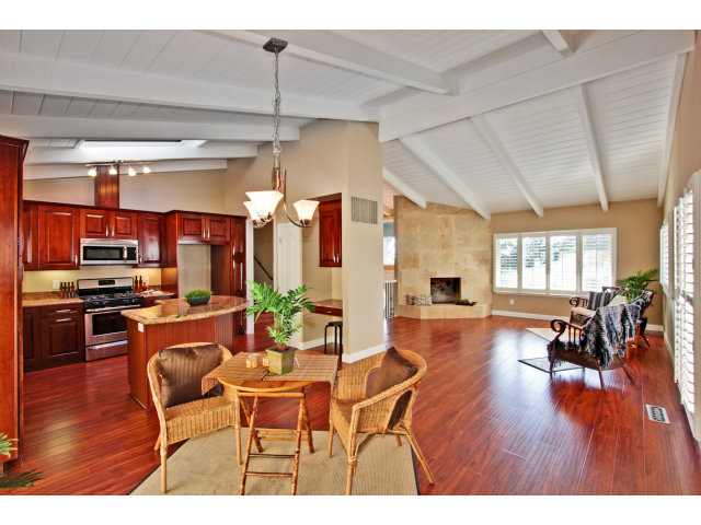 457 Monterey Drive Aptos, CA 95003 - Photo 4 of 11 a dining room with furniture a chandelier and wooden floor