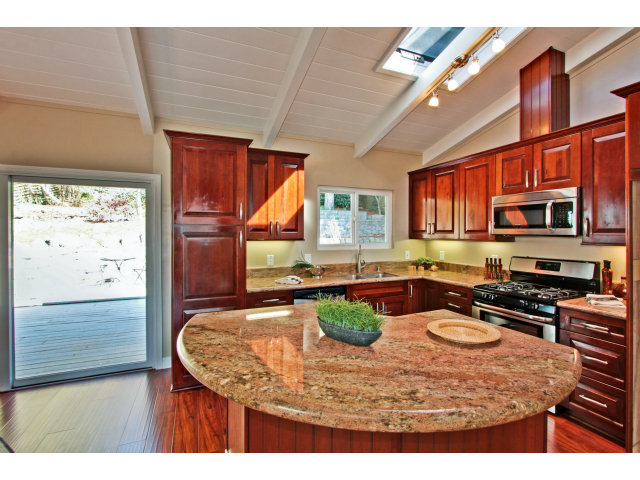 457 Monterey Drive Aptos, CA 95003 - Photo 8 of 11 a kitchen with stainless steel appliances granite countertop a stove a sink and a microwave
