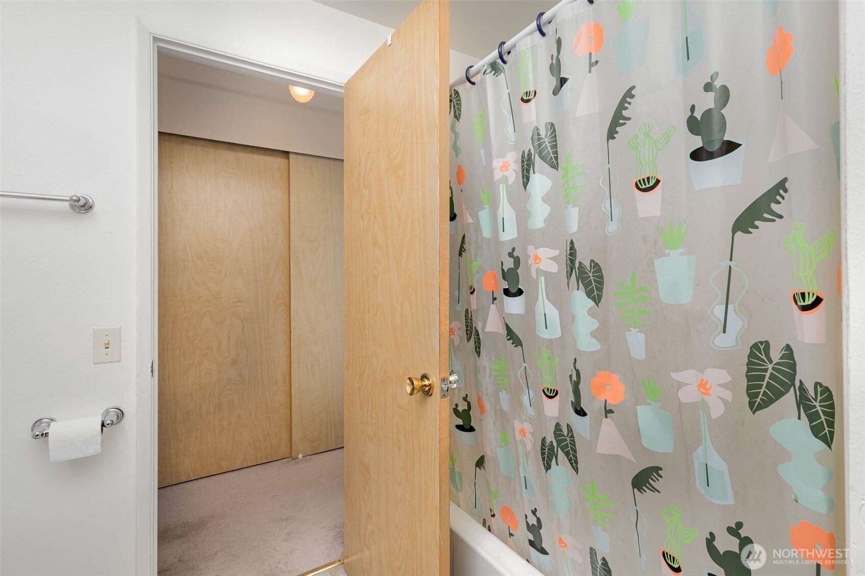 2107 Southeast 21st Court Renton, WA 98055 - Photo 11 of 28 a bathroom with a shower and a shower curtain