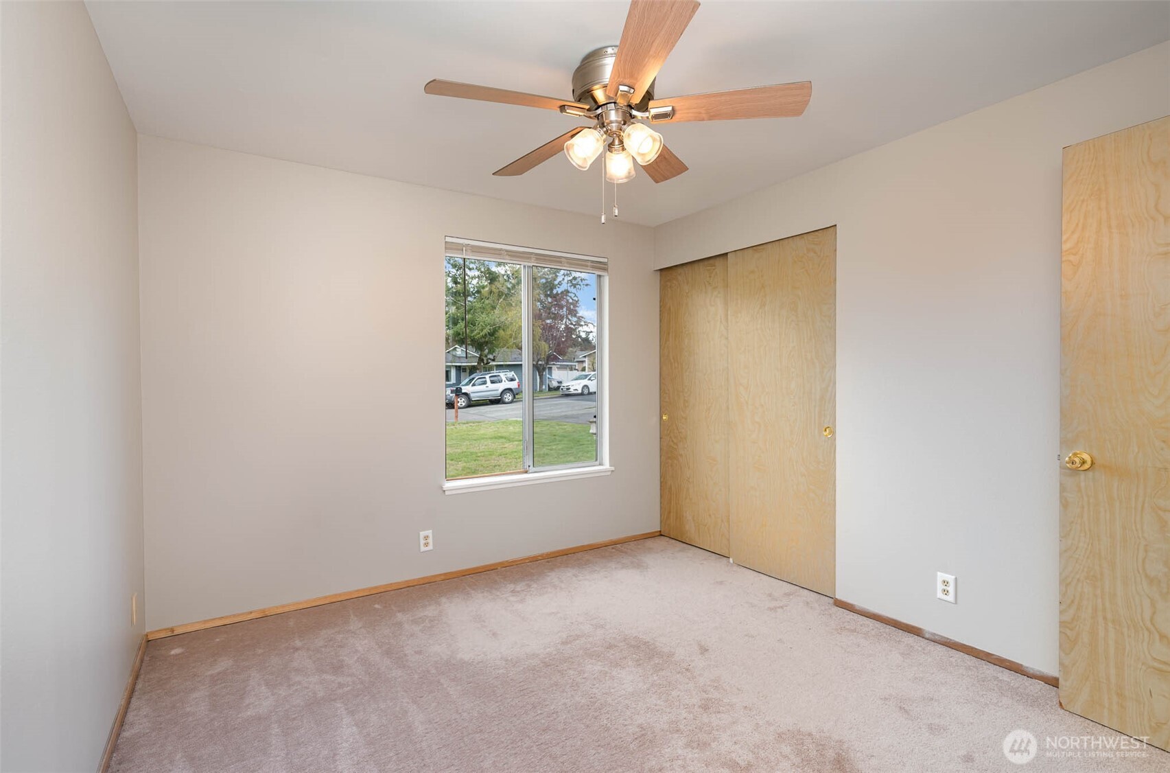 2107 Southeast 21st Court Renton, WA 98055 - Photo 14 of 28 an empty room with windows and chandelier fan