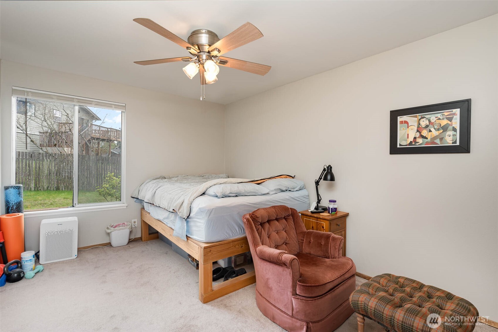 2107 Southeast 21st Court Renton, WA 98055 - Photo 17 of 28 a bedroom with a bed and a chandelier
