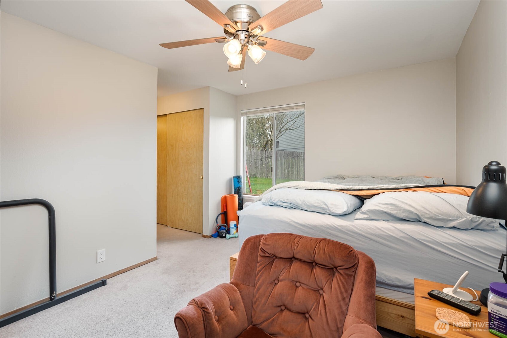 2107 Southeast 21st Court Renton, WA 98055 - Photo 18 of 28 a bedroom with furniture and a chandelier