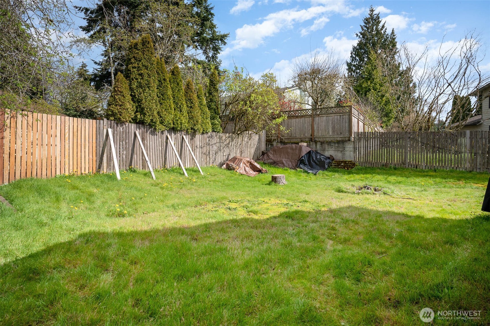 2107 Southeast 21st Court Renton, WA 98055 - Photo 24 of 28 a view of a backyard with a small cabin