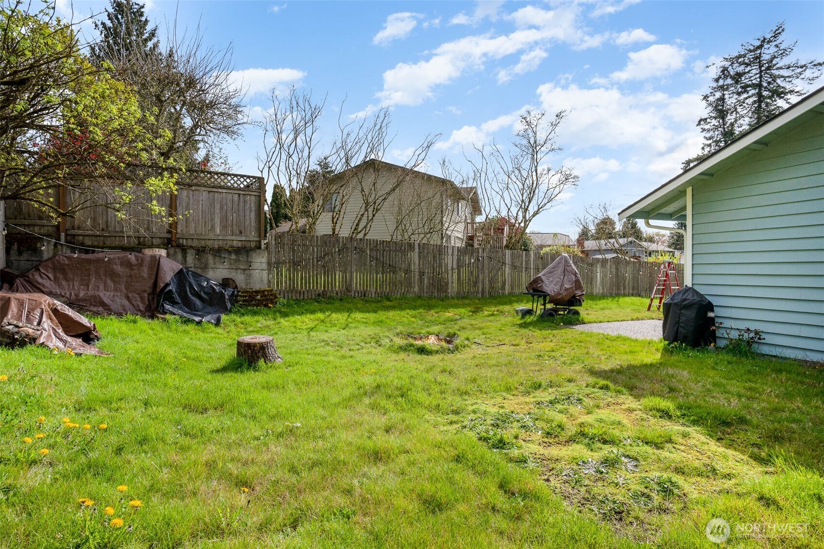 2107 Southeast 21st Court Renton, WA 98055 - Photo 25 of 28 a view of a backyard with a garden