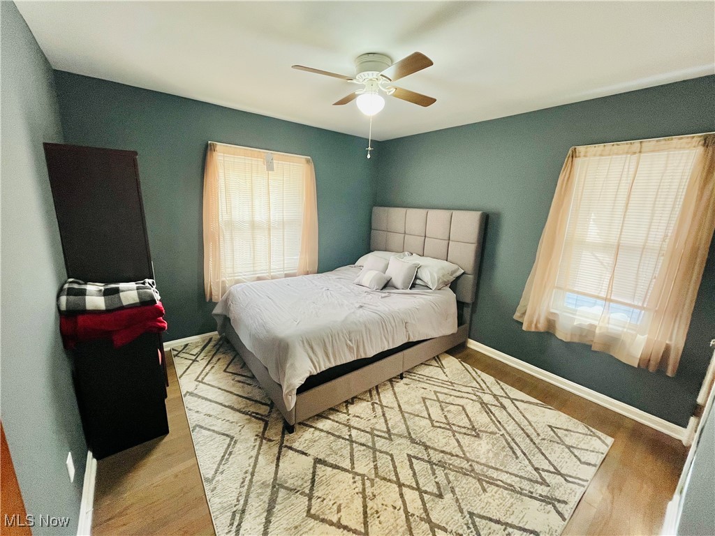 30009 Elgin Road Wickliffe, OH 44092 - Photo 16 of 44 Bedroom featuring multiple windows, wood-type flooring, and ceiling fan