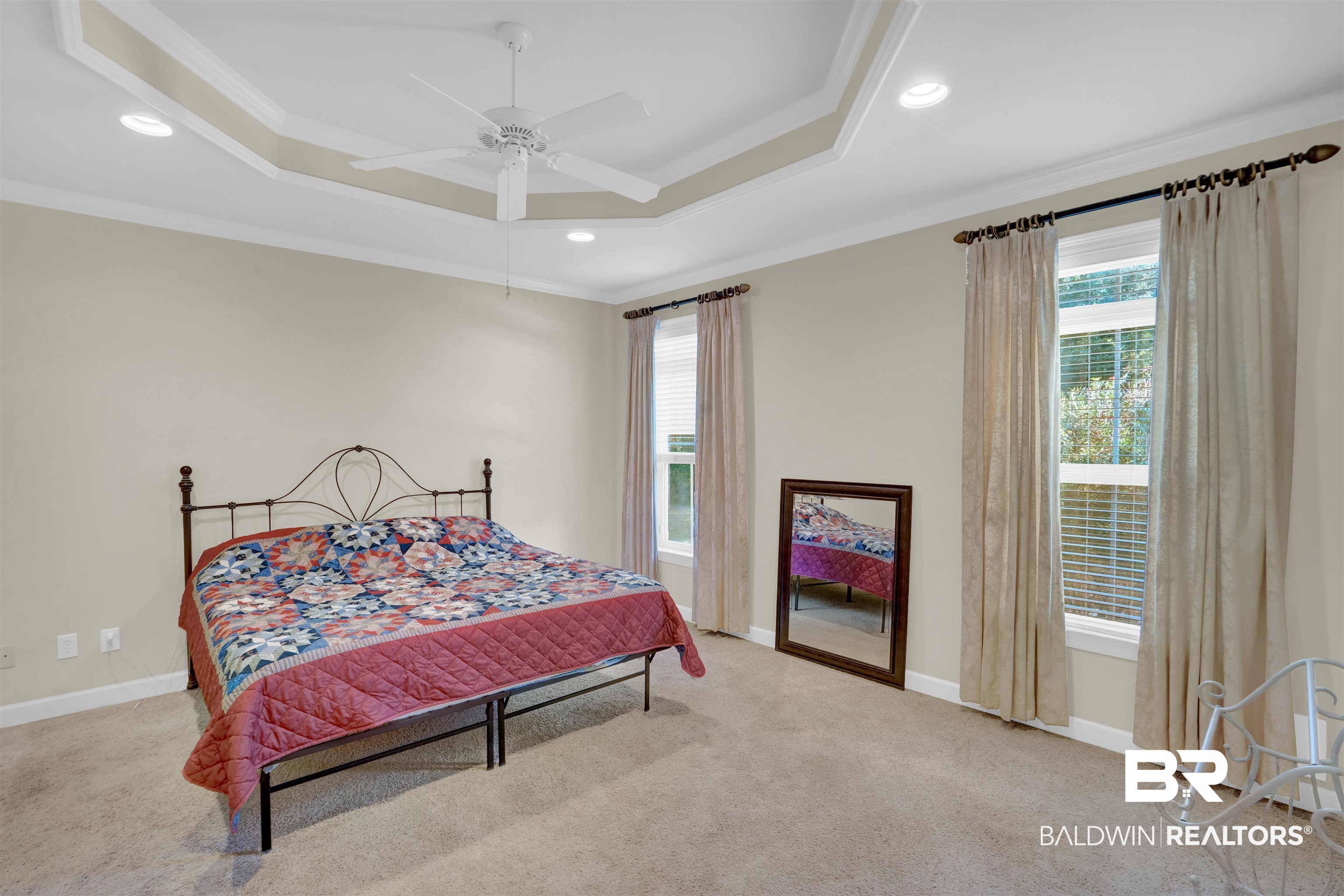10951 Driver Court Fairhope, AL 36532 - Photo 25 of 46 Carpeted bedroom with a raised ceiling, ornamental molding, and ceiling fan