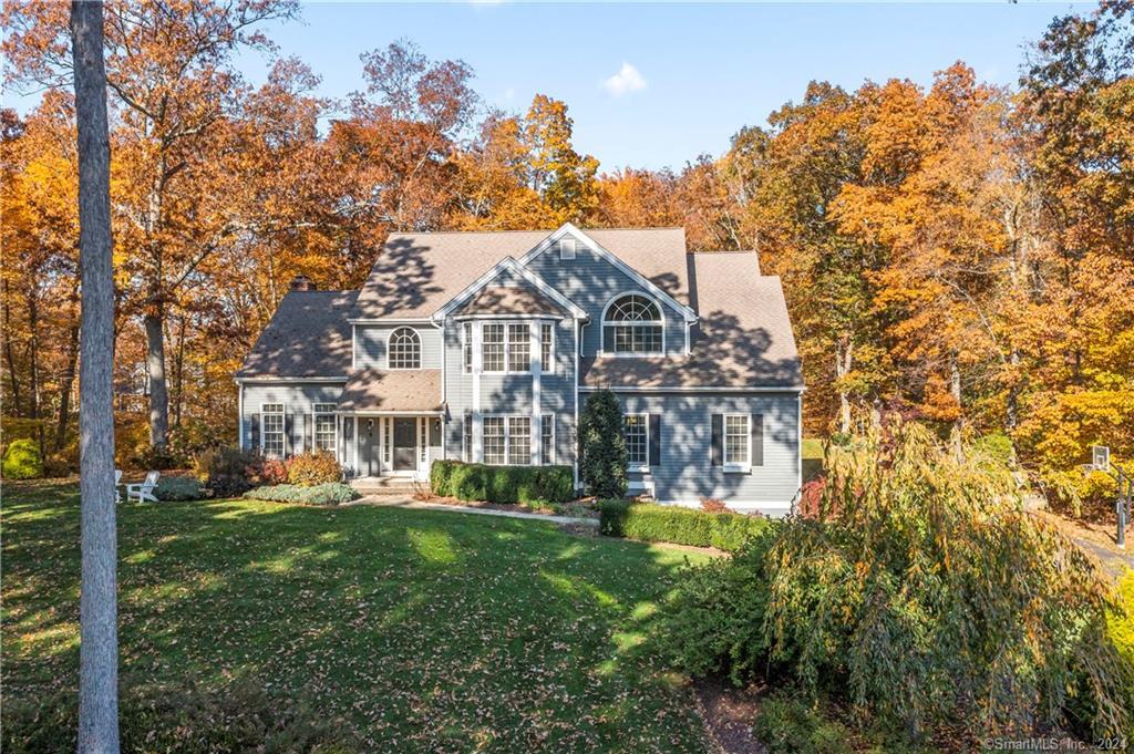 5 Clapboard Ridge Newtown, CT 06482 - Photo 1 of 1 a front view of a house with a garden