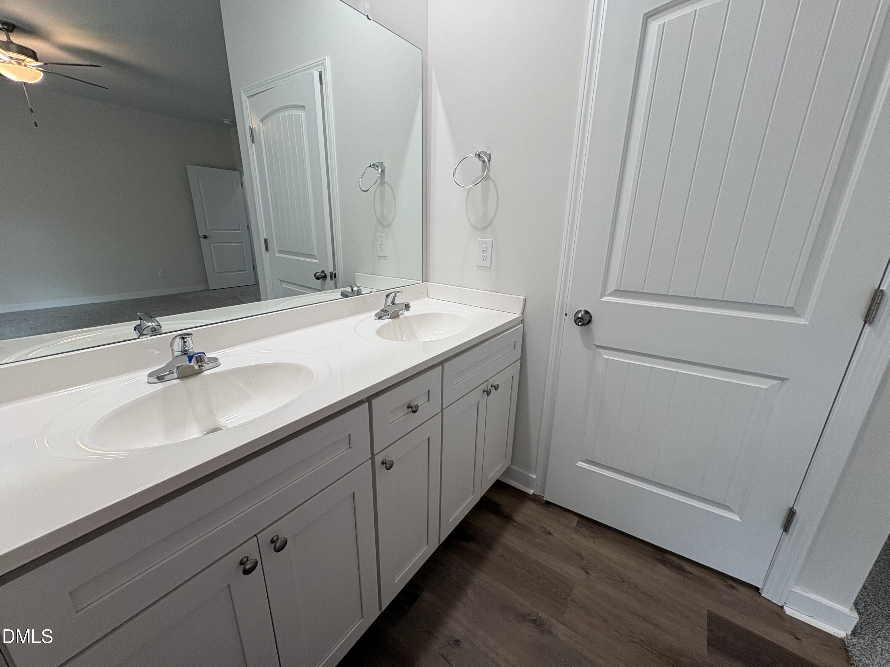 56 Jacobs Ridge Drive Four Oaks, NC 27524 - Photo 11 of 17 a bathroom with a double vanity sink and mirror