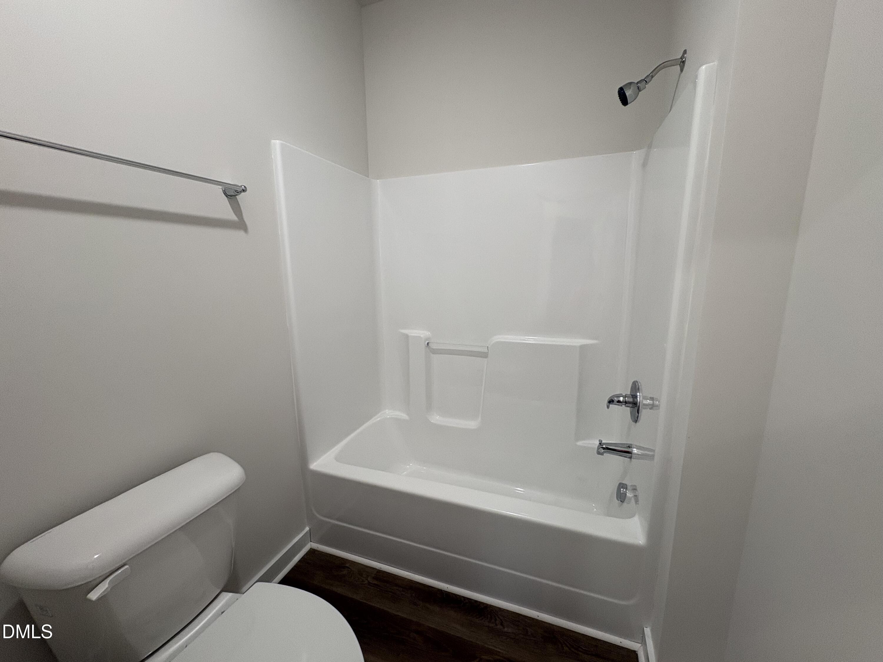 56 Jacobs Ridge Drive Four Oaks, NC 27524 - Photo 12 of 17 a bathroom with a toilet and a bathtub
