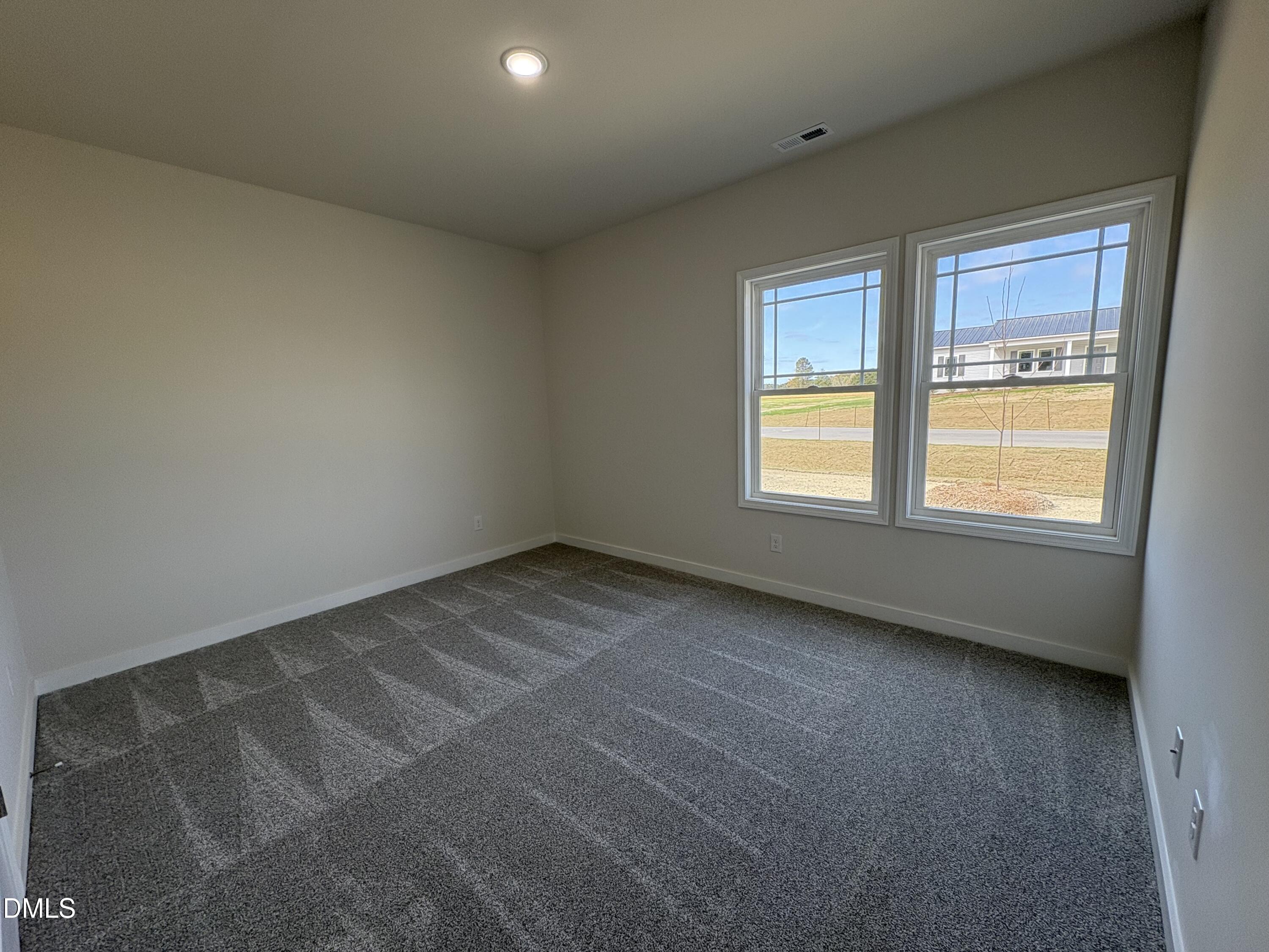 56 Jacobs Ridge Drive Four Oaks, NC 27524 - Photo 13 of 17 an empty room with a window