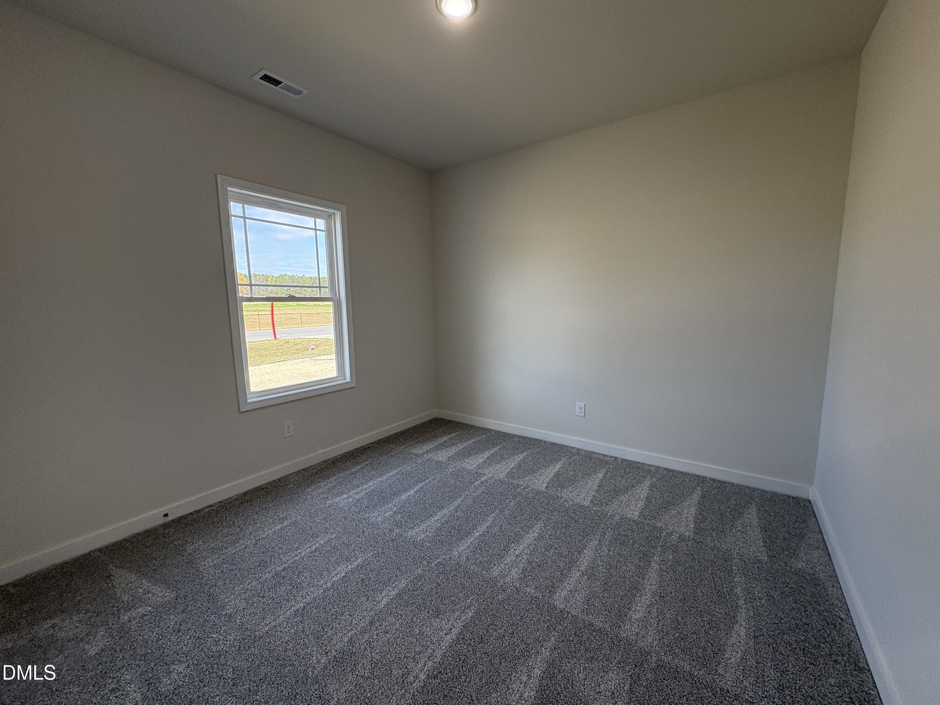 56 Jacobs Ridge Drive Four Oaks, NC 27524 - Photo 14 of 17 an empty room with a window