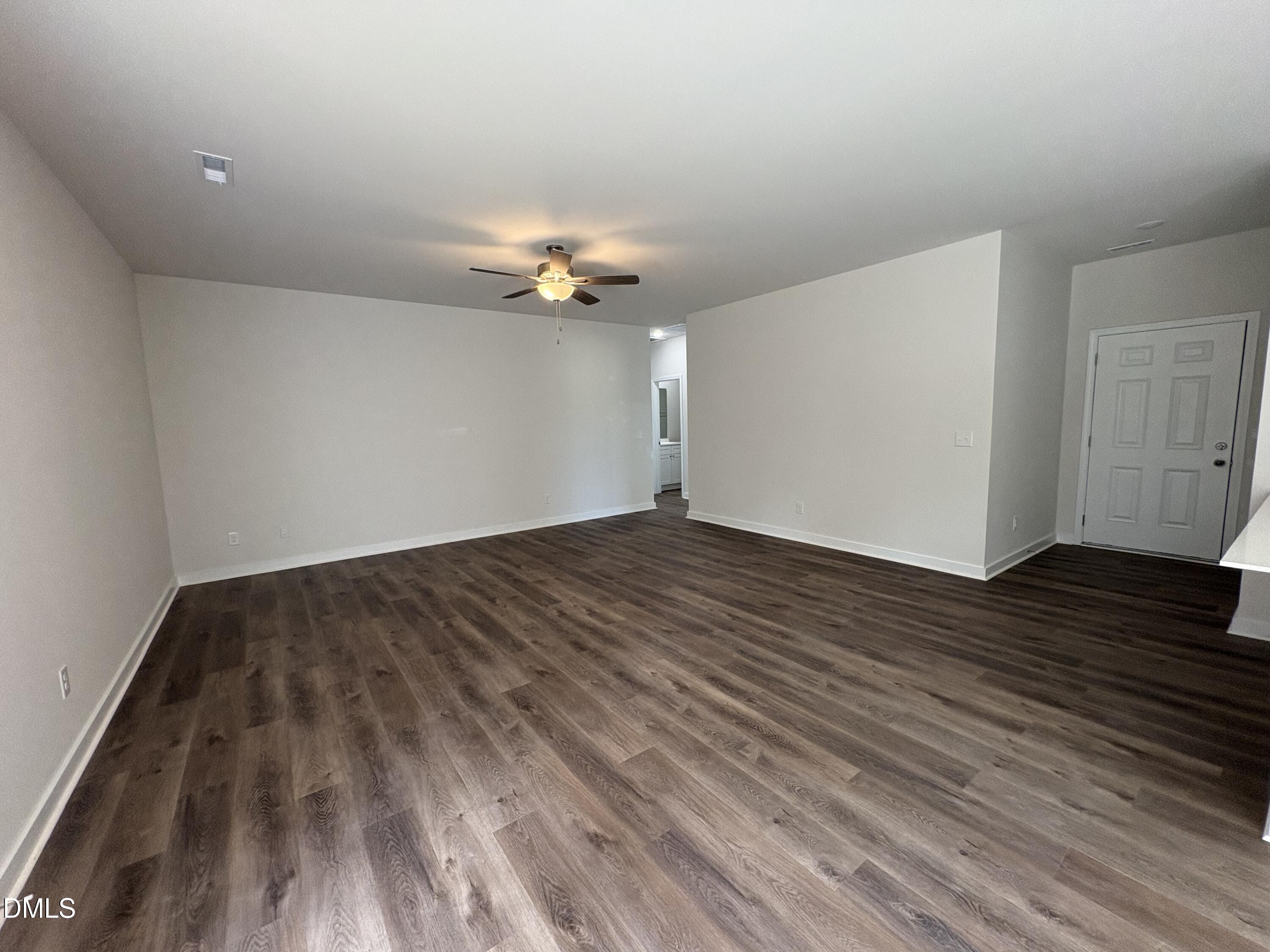 56 Jacobs Ridge Drive Four Oaks, NC 27524 - Photo 4 of 17 wooden floor in an empty room with a window