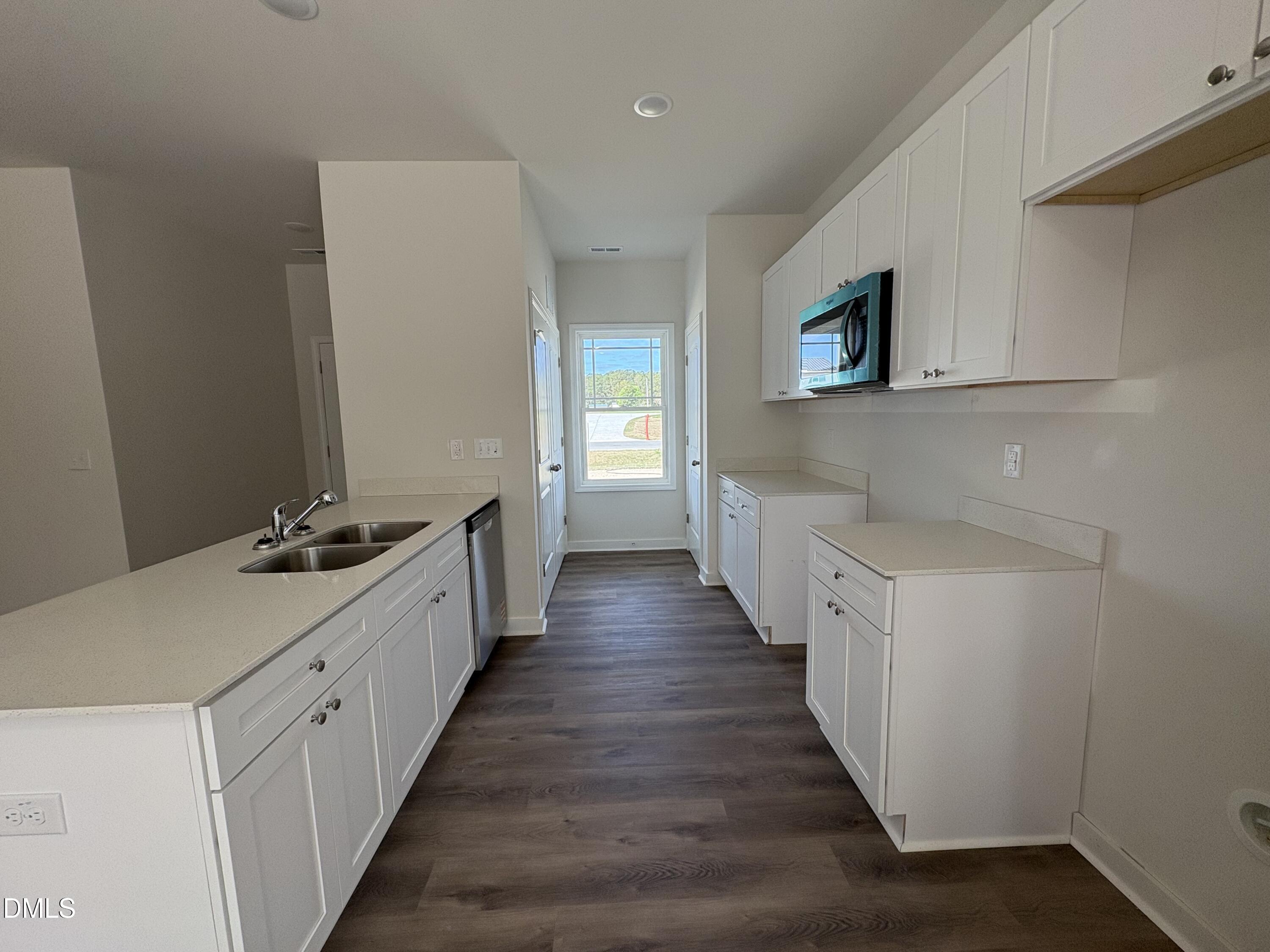 56 Jacobs Ridge Drive Four Oaks, NC 27524 - Photo 5 of 17 a kitchen with sink and cabinets