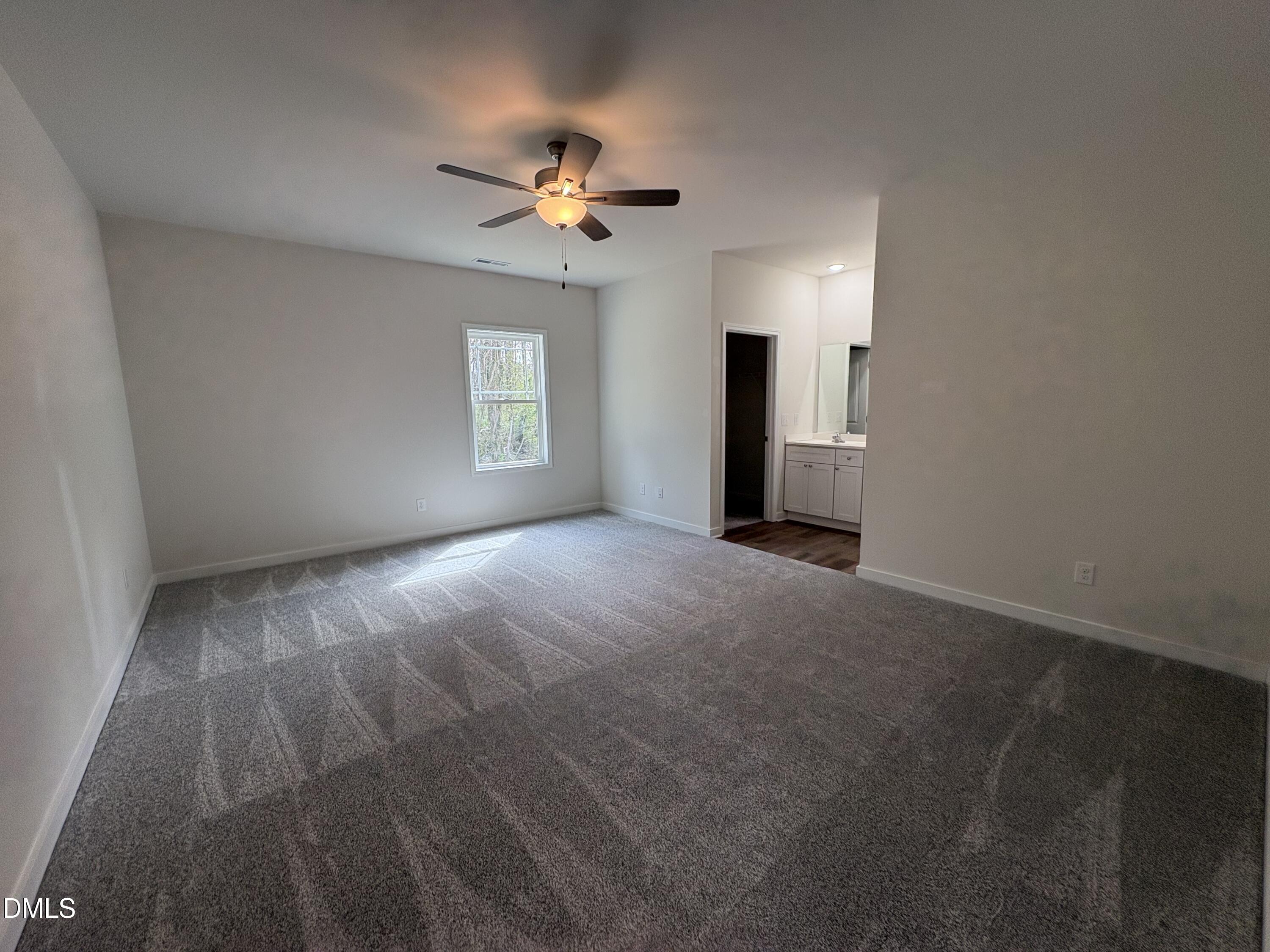 56 Jacobs Ridge Drive Four Oaks, NC 27524 - Photo 9 of 17 a view of an empty room with a window