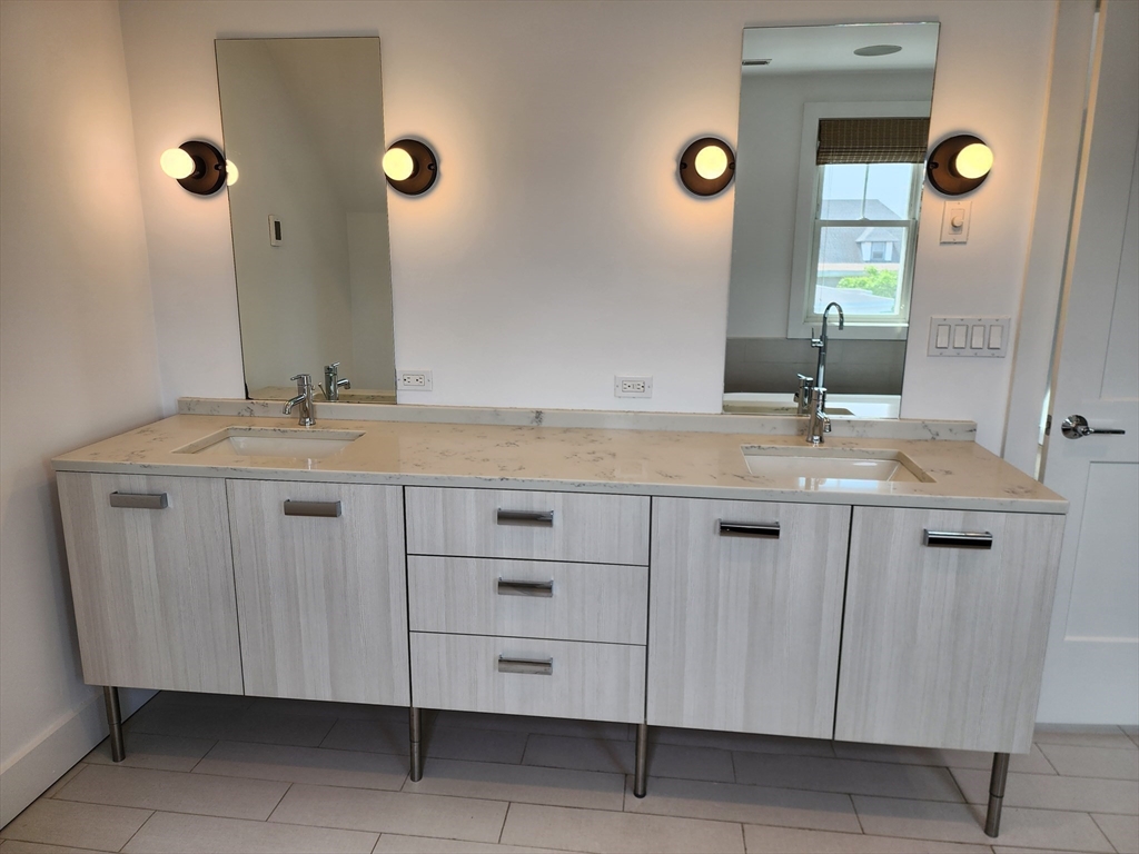 84 Romsey Street, Unit 3 Boston, MA 02125 - Photo 13 of 20 a bathroom with a granite countertop sink and a mirror