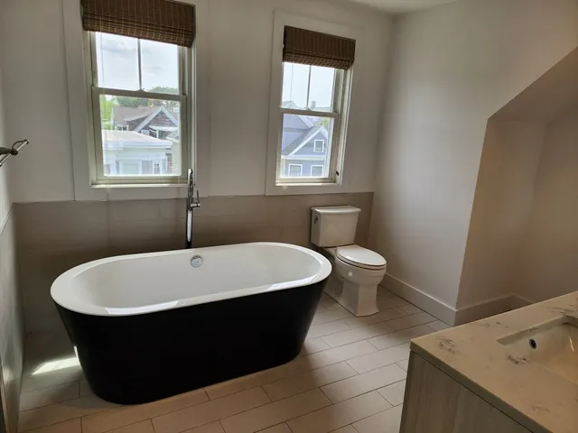 a white bath tub sitting in a bathroom
