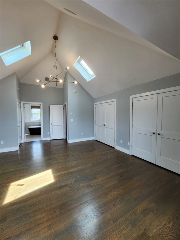84 Romsey Street, Unit 3 Boston, MA 02125 - Photo 17 of 20 a view of a room with wooden floor chandelier and windows