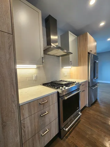 a kitchen with a stove and a refrigerator
