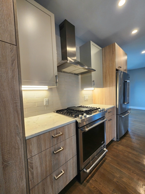 84 Romsey Street, Unit 3 Boston, MA 02125 - Photo 4 of 20 a kitchen with a stove and a refrigerator
