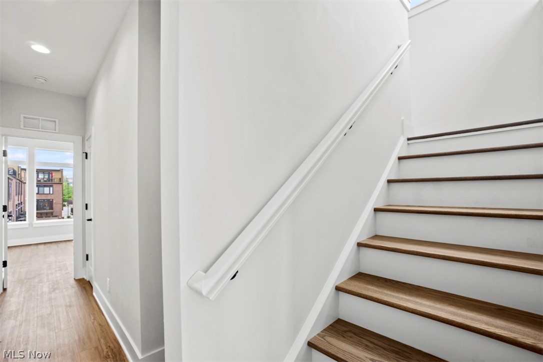 2291 West 19th Street Cleveland, OH 44113 - Photo 30 of 47 Staircase with hardwood / wood-style flooring
