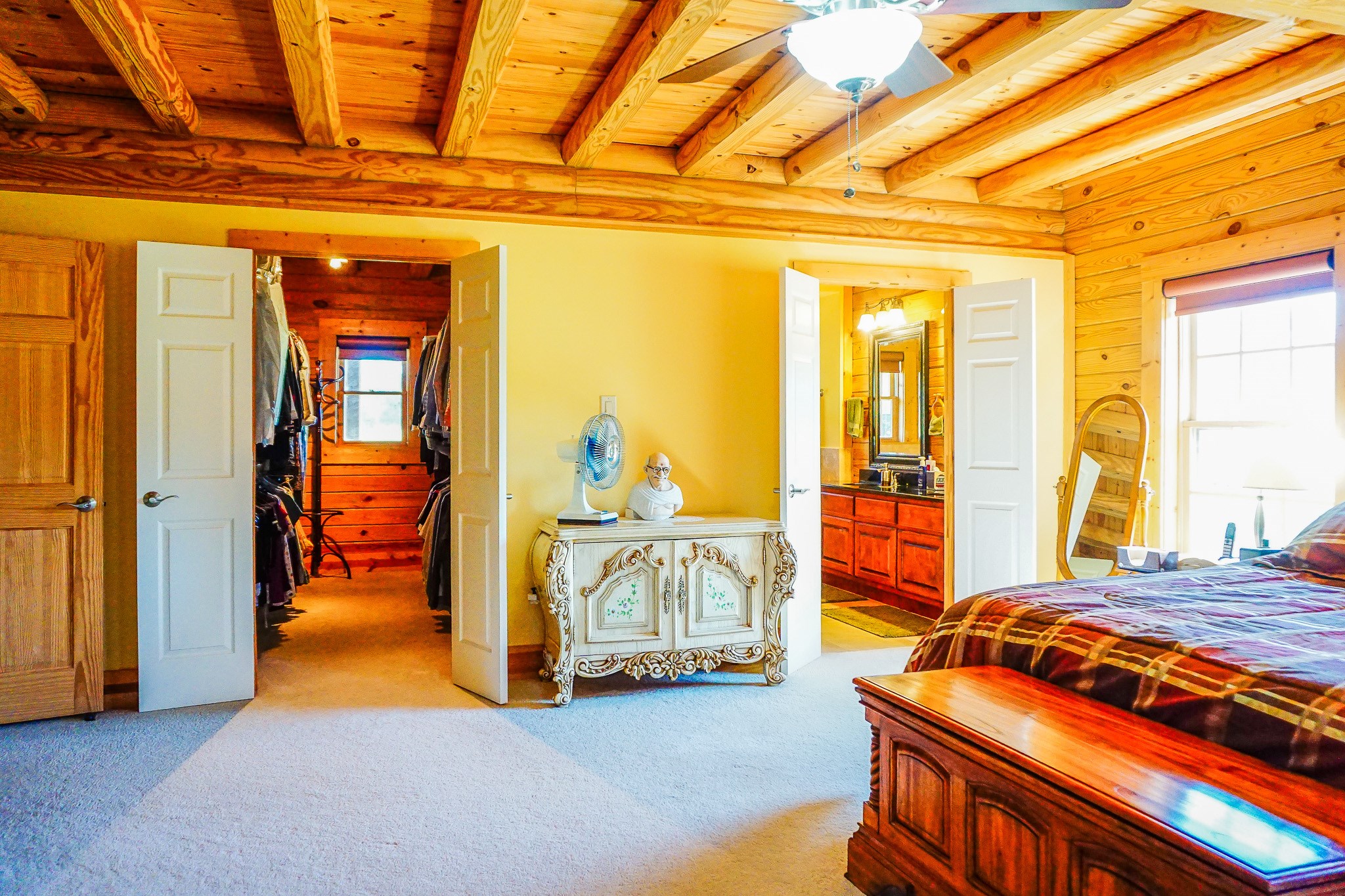 8786 Highway 75 Huntsville, TX 77340 - Photo 20 of 40 a bedroom with furniture and large windows