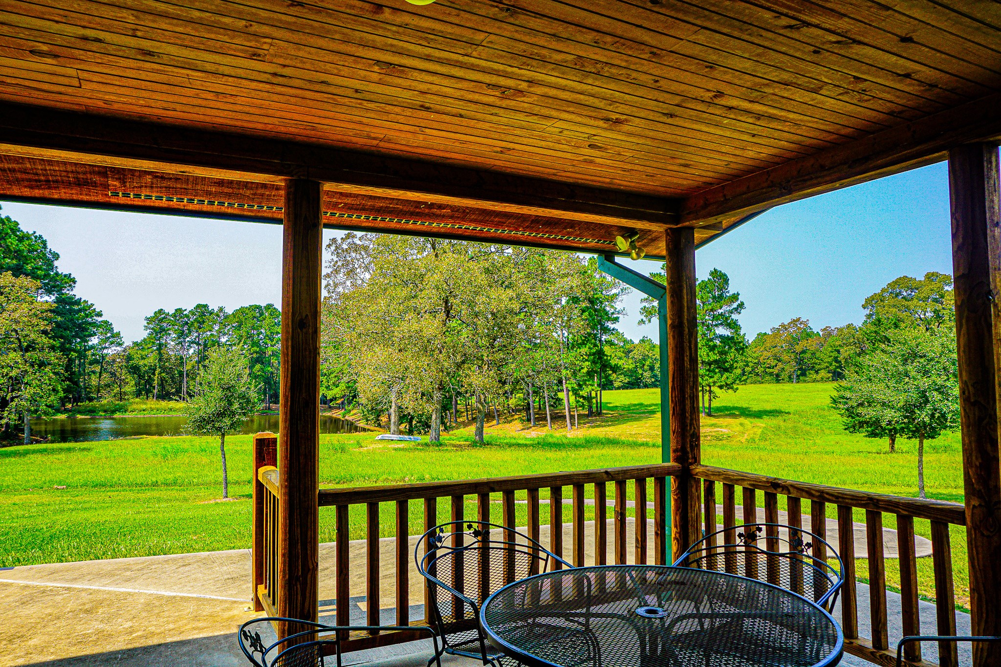 8786 Highway 75 Huntsville, TX 77340 - Photo 30 of 40 a view of a patio with a table chairs and backyard