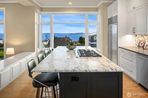 a dining table with a large window
