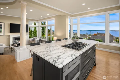 a kitchen that has a sink and a stove in it