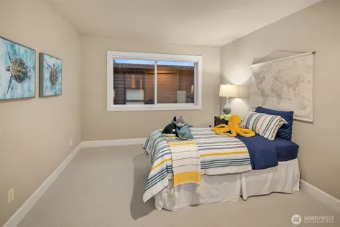 a bedroom with a bed and wall painting