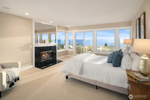 a bedroom with a bed and a fireplace