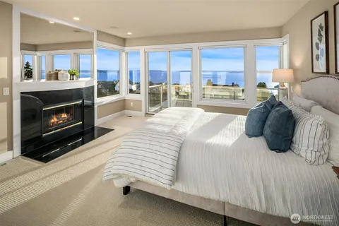 a spacious bedroom with a bed and a cabinets