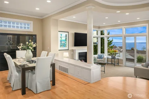 a living room with fireplace furniture and a flat screen tv