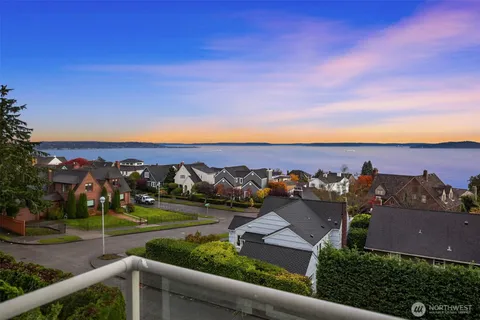 an aerial view of a house with a yard basket ball court and outdoor seating