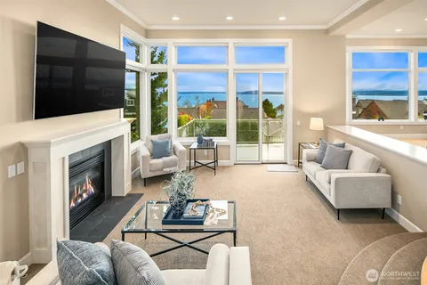 a living room with furniture fireplace and flat screen tv