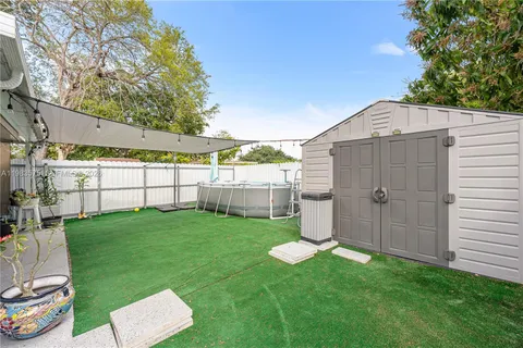 a view of backyard with a garden and plants