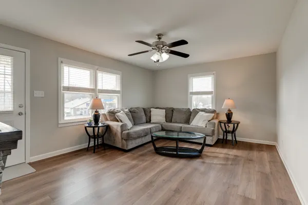 a living room with furniture and a window