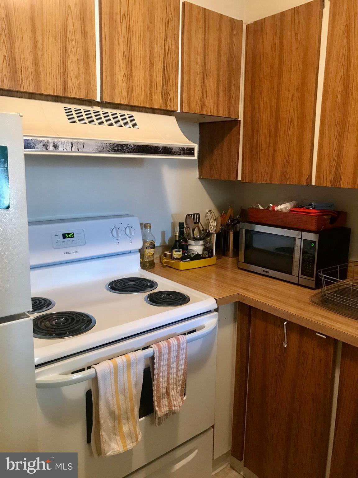226 West Rittenhouse Square, Unit 307 Philadelphia, PA 19103 - Photo 4 of 18 a kitchen with a stove and a cabinets