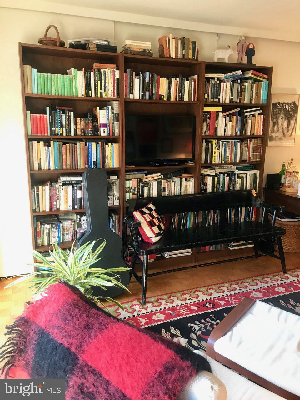 226 West Rittenhouse Square, Unit 307 Philadelphia, PA 19103 - Photo 5 of 18 a living room with bookshelf
