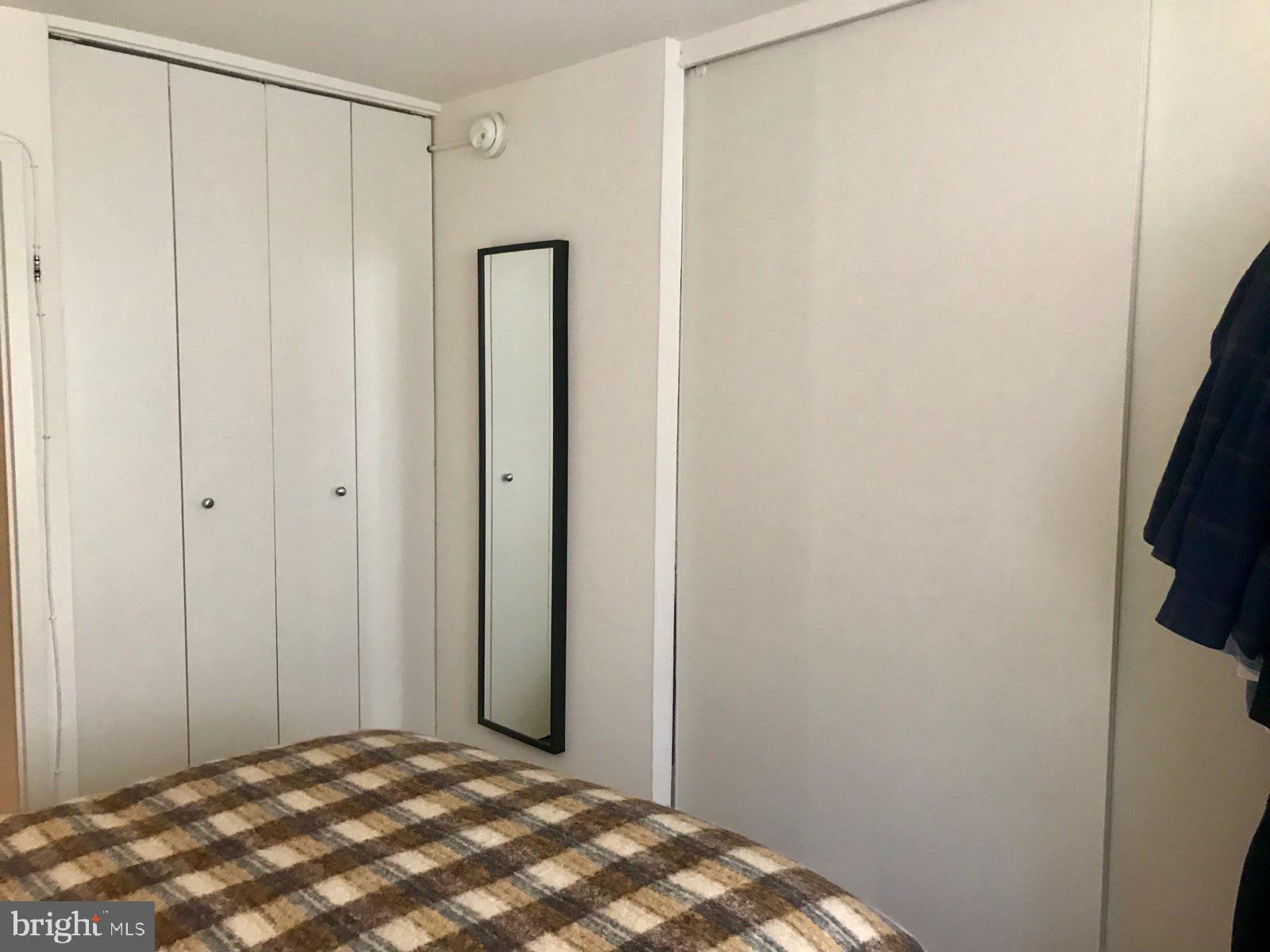 226 West Rittenhouse Square, Unit 307 Philadelphia, PA 19103 - Photo 7 of 18 a bedroom with a bed and a shower