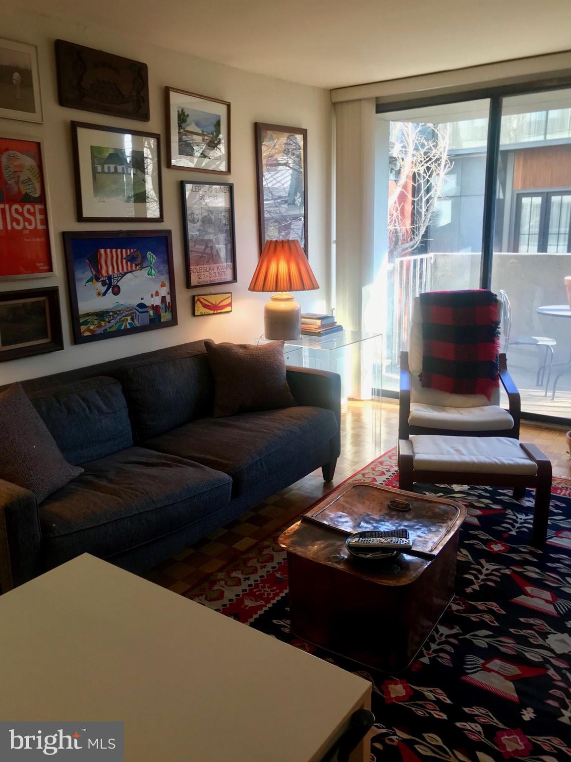226 West Rittenhouse Square, Unit 307 Philadelphia, PA 19103 - Photo 9 of 18 a living room with furniture and a fireplace