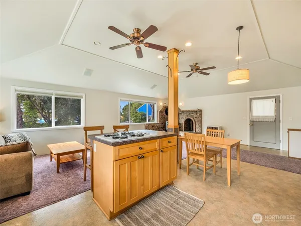 a view of a kitchen area with furniture and a table