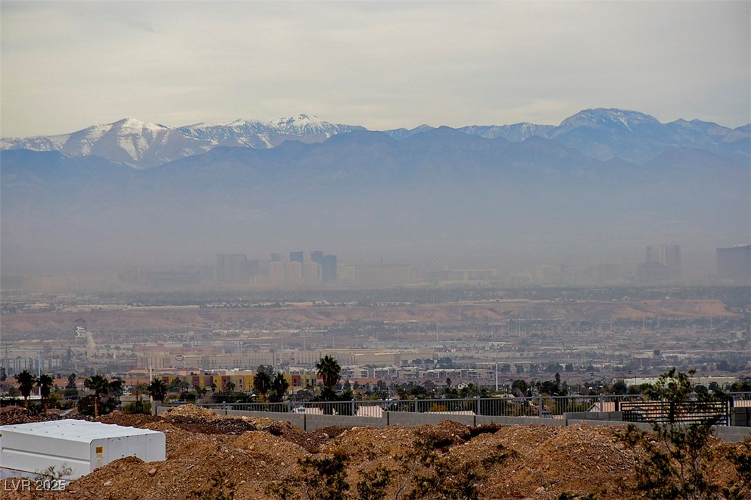 View of mountain background featuring nearby urban area