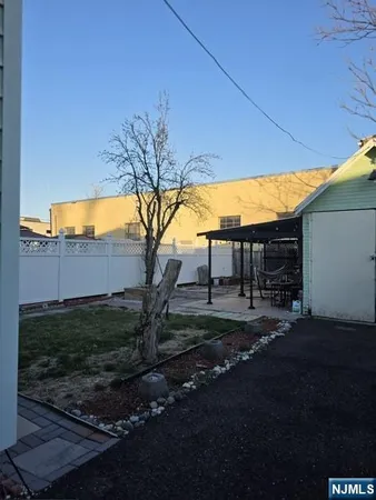 a view of a backyard of the house