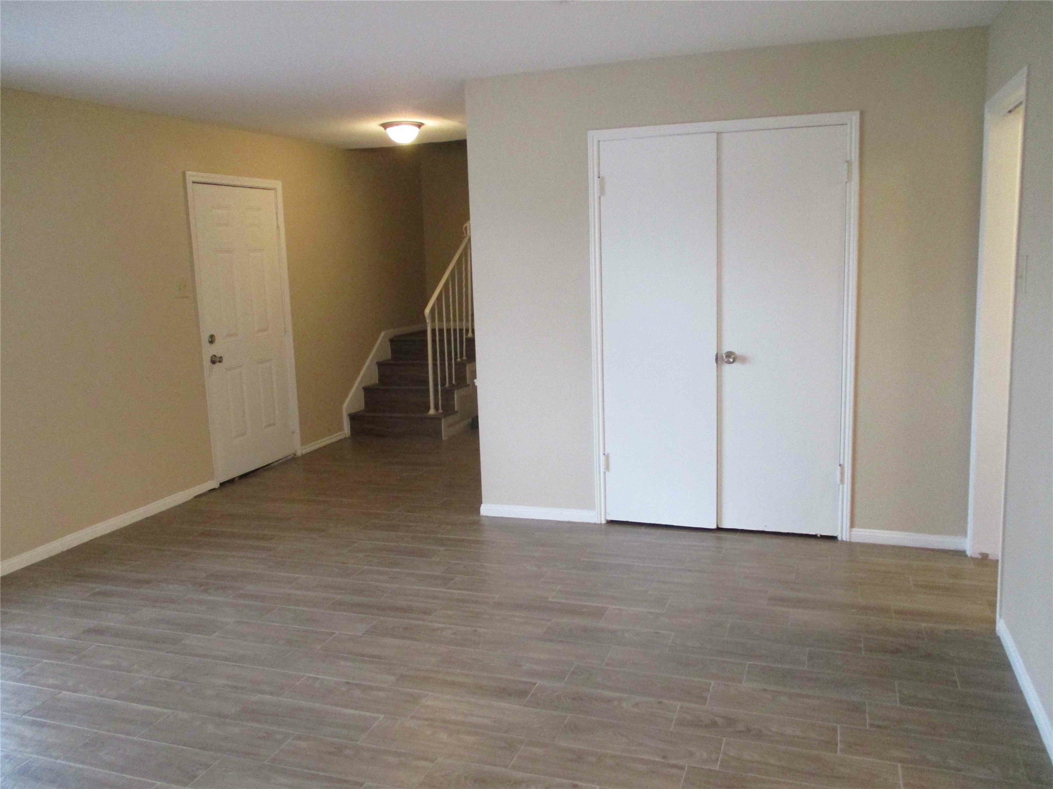 5506 Deep Forest Drive Houston, TX 77092 - Photo 4 of 16 a view of an empty room with wooden floor