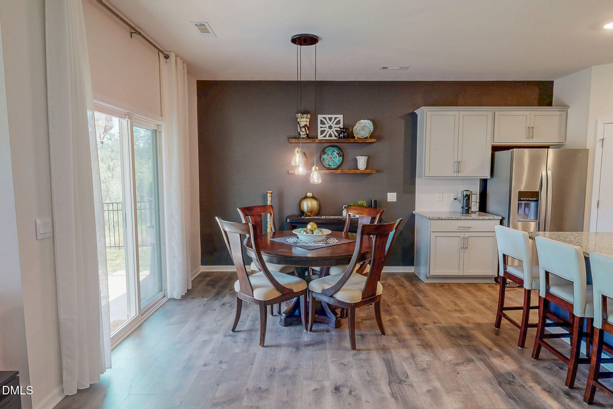 1017 Broadlands Way Graham, NC 27253 - Photo 15 of 32 a view of a dining room with furniture window and wooden floor