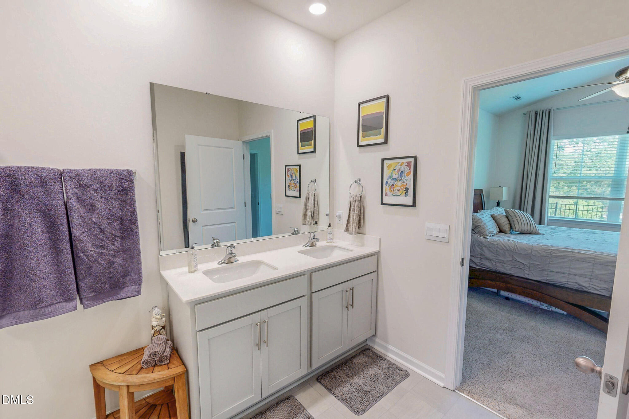 1017 Broadlands Way Graham, NC 27253 - Photo 17 of 32 a en suite bathroom with a double vanity sink and a mirror