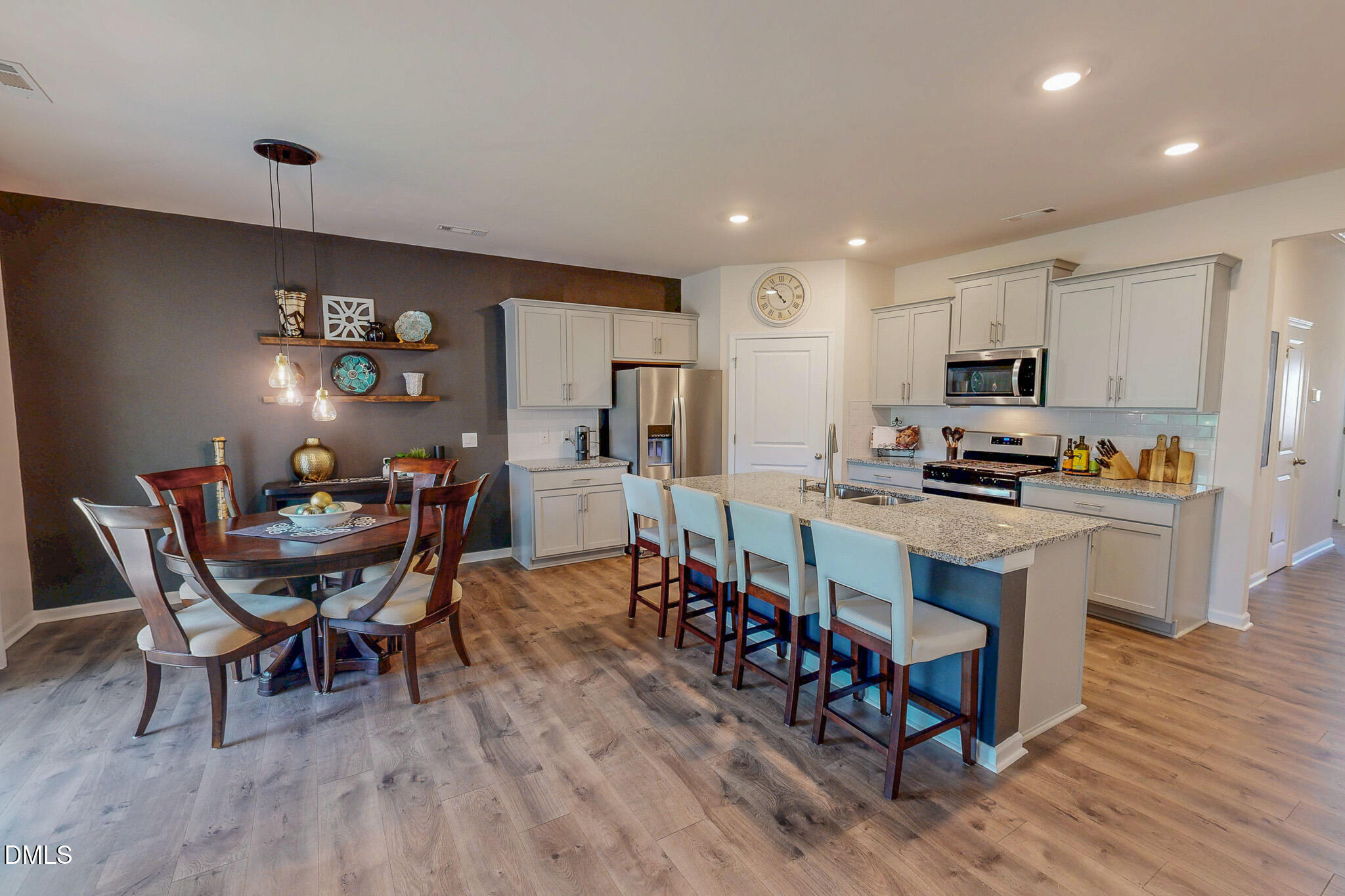 1017 Broadlands Way Graham, NC 27253 - Photo 2 of 32 a view of a dining room with furniture and wooden floor